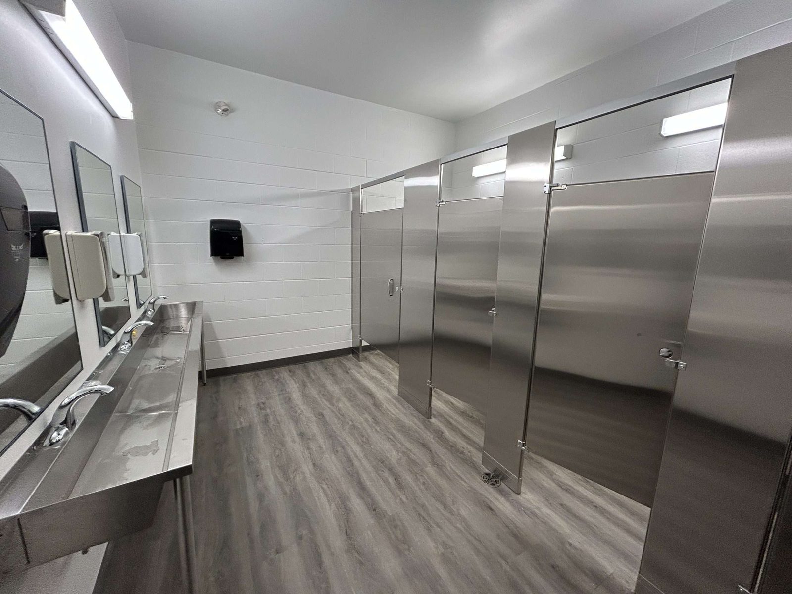 New commercial washroom with a multi-sink vanity